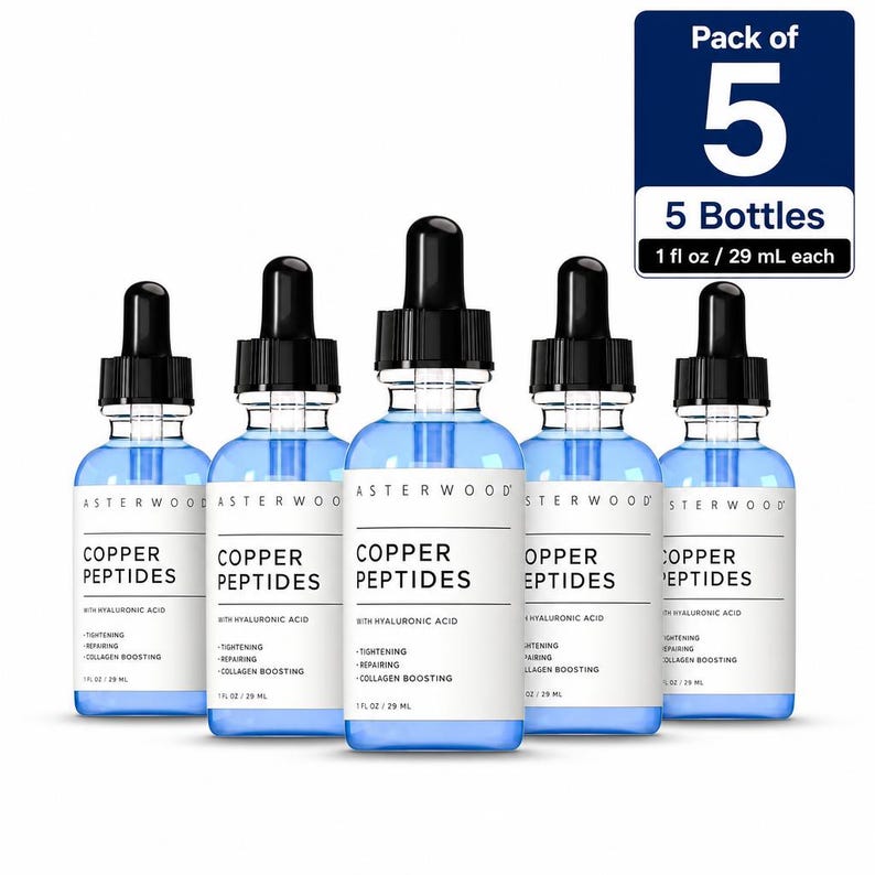 May include: A pack of five clear glass dropper bottles containing blue liquid, labeled Asterwood Copper Peptides with Hyaluronic Acid. Each bottle is 1 fl oz. The labels list benefits including tightening, repairing, and collagen boosting.