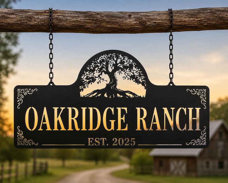 May include: A black metal sign hanging from a wooden beam by two chains. The sign features a cutout of an oak tree at the top, the text OAKRIDGE RANCH in large letters, and the text EST. 2025 below, with decorative filigree patterns in the corners.