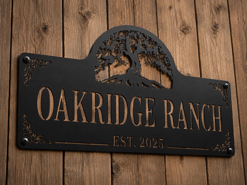May include: A rectangular black metal sign with an arched top featuring a laser-cut tree silhouette. The sign displays the text OAKRIDGE RANCH and EST. 2025 in a cutout style, revealing a wood-toned background through the lettering and tree.