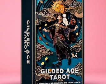 May include: A rectangular Gilded Age Tarot deck box featuring a layered paper-cut style illustration of a figure with a white dog, a sun, and gold coins. The dark blue box displays the text Gilded Age Tarot and Layered realms, glimpsing the truth of fate.