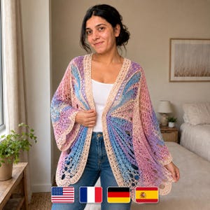 May include: A colorful, open-front crochet cardigan in shades of pink, blue, and beige. The handmade garment features a unique, openwork design with long sleeves and a scalloped edge. The cardigan is worn over a white top and blue jeans.