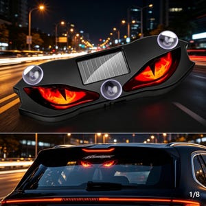 May include: A black, solar-powered automotive warning light featuring two glowing red, reptilian-style eyes. The device has three clear suction cups for mounting and a rectangular solar panel centered between the two illuminated eye-shaped lenses.