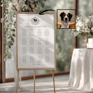May include: A vertical wedding seating chart in a light wood frame on a tripod stand. The white sign features the text "SETH HAS PICKED YOUR SPOT" and "Ella & Jack" with a small illustration of a dog in a crest. A separate square photo of a black and white dog is shown.