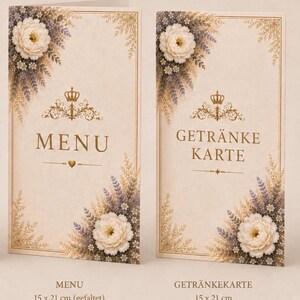 Könnte beinhalten: Zwei rechteckige Karten im Format 15 x 21 cm, beschriftet mit MENU und GETRÄNKE KARTE. Beide zeigen einen cremefarbenen Hintergrund, goldene Filigranränder, eine goldene Krone als zentrales Symbol sowie florale Motive aus weißen Rosen und Lavendel.