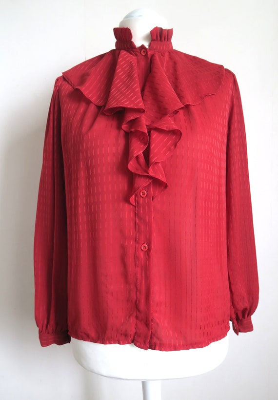 red ruffle neck blouse
