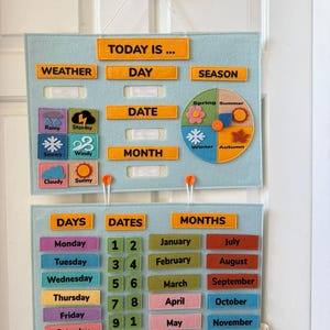May include: A light blue felt educational calendar with orange text labels for weather, day, date, month, and season. Includes weather icons and a seasonal wheel. The lower section displays days, dates, and months with colorful labels.