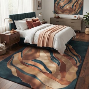 May include: A rectangular area rug featuring a large-scale abstract pattern of flowing, organic shapes in shades of deep teal, warm copper, and soft beige. The design mimics the movement of layered waves, creating a bold focal point on the floor.