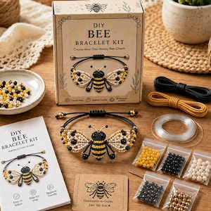 May include: A DIY bee bracelet kit featuring a cardboard box with a bee illustration, an instruction guide, black and yellow cords, clear string, and small plastic bags containing yellow, black, white, and metallic beads for assembly.