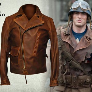 May include: A brown leather motorcycle jacket with an asymmetrical zipper, a wide collar, and a zippered chest pocket. The jacket features a flap pocket on the lower right side and a gold-toned zipper pull. The logo RIVARO JACKETS is visible.