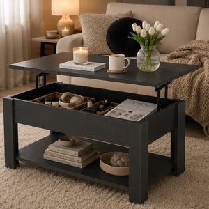 May include: A dark gray lift-top coffee table with a lower shelf. The top is partially raised, revealing storage space with baskets, books, and a magazine. A vase of white tulips sits on the table, along with a candle and mug.