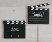Claqueta de adorno para photocall con mensajes
