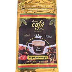 May include: A gold foil coffee bag with the text "Super Café D'or". The bag features a graphic of a coffee cup with the words "Noir Intense". The text "Le goût filtré et Royal" is also visible. The bag contains Robusta 60% / Arabica 40% coffee.