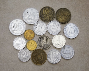 May include: A collection of vintage Czech coins in various denominations, including 1, 2, 5, 10, 20, and 25. The coins are made of silver and copper and feature different designs, including a woman with a sickle, a crown, and a wheat stalk.