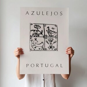 May include: Black and white poster with the word "AZULEJOS" at the top and "PORTUGAL" at the bottom. The center of the poster features a stylized illustration of four square tiles with black and white designs of birds, flowers, and animals.