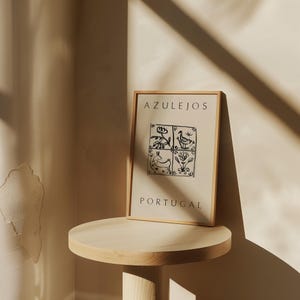 May include: A framed print with a black and white illustration of four traditional Portuguese tiles. The tiles feature a bird, a flower, a rabbit, and another flower. The print has the text "AZULEJOS PORTUGAL" at the top and bottom.