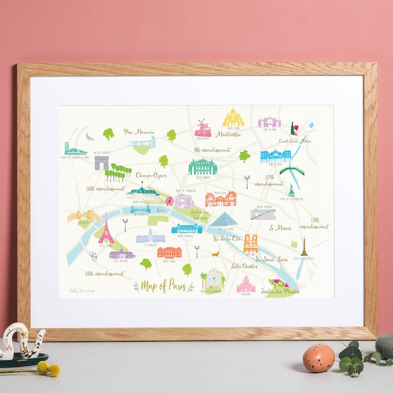 May include: A colorful illustrated map of Paris, France, with landmarks and neighborhoods labeled. The map includes the Eiffel Tower, the Louvre, Notre Dame Cathedral, and the Champs-Elysees.