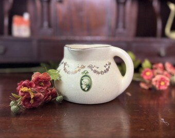 Antiek Roseville-aardewerkmedaillon uit de jaren 1910 Creamware