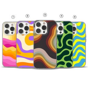 May include: Five smartphone cases arranged in a row, each featuring a distinct wavy, abstract pattern. The designs include color combinations of pink and orange, purple and yellow, brown and tan, dark green and light green, and blue and yellow.
