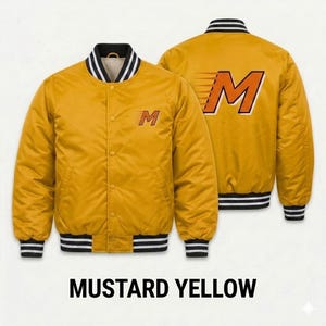 May include: A mustard yellow varsity jacket featuring a snap-button front closure, long sleeves, and black and white striped ribbed trim on the collar, cuffs, and hem. The front and back display a stylized letter M with motion lines.