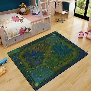 May include: A rectangular area rug featuring a detailed, top-down digital illustration of a fantasy game map. The design displays a vibrant landscape with winding paths, dense green forests, blue water features, and glowing orange light markers.