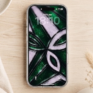 May include: A smartphone with a clear protective case displaying a lock screen with the date Fri 5 Jun and time 18:10. The wallpaper features a dark green and silver geometric pattern resembling stained glass with sharp, intersecting lines.