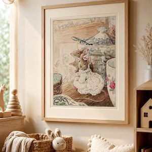 May include: A framed illustration featuring two anthropomorphic mice in a kitchen setting. One mouse wears a floral dress and a pink hair accessory. They are positioned near a large ceramic bowl with blue patterns and a silver spoon inside.