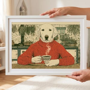 May include: A framed art print featuring a dog with a human-like appearance, wearing a red sweater and holding a teacup. The artwork has a vintage aesthetic, with a detailed background of a kitchen scene. The frame is white.