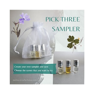 May include: A white organza bag containing three small glass bottles of perfume. The bottles are labelled with the text "Aether Arts Perfume". The image also includes the text "Pick Three Sampler" and "Create your own sampler and save. Choose the scents that you want to try."