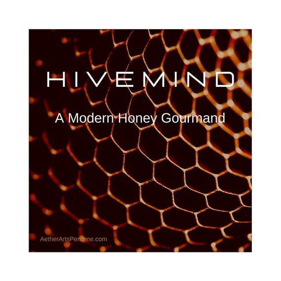 HiveMind: A Modern, Honey, Gourmand perfume. A tribute to the bees of the world with a modern twist, a reimagining of bees in space!
