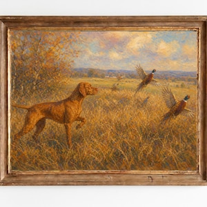 May include: An oil painting in a weathered wooden frame depicting a golden-brown hunting dog standing in a field of tall, dry grass. Two pheasants are shown in flight against a soft, cloudy sky with autumn-colored trees in the background.