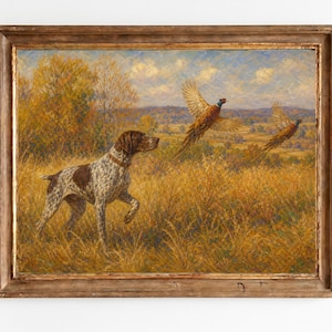 May include: An oil painting in a weathered wooden frame depicting a brown and white spotted hunting dog standing in a golden field of tall grass, with two pheasants taking flight against a backdrop of rolling hills and a blue sky with clouds.
