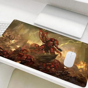 May include: A rectangular desk mat featuring a detailed fantasy illustration of red-armored soldiers in a chaotic battlefield scene. The artwork depicts figures in heavy armor, one holding a large banner, amidst smoke and debris in a war zone.