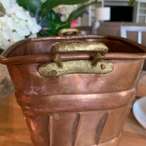 Vintage antique copper bucket with brass handles