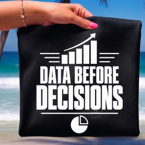 May include: A black fabric item featuring a white graphic print of a bar chart with an upward-trending arrow, the text "DATA BEFORE DECISIONS" in bold capital letters, and a circular pie chart icon positioned at the bottom of the design.