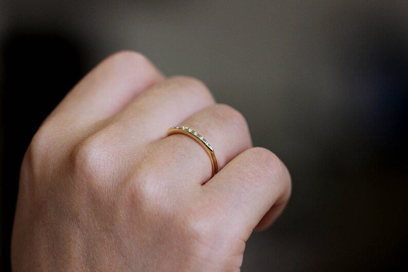 thin gold ring with tiny diamond