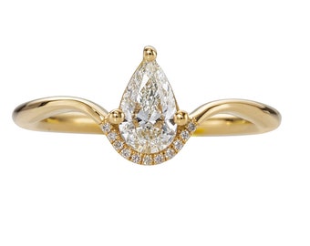 Floating Pear Cut Diamond Engagement Ring in a Classic Style