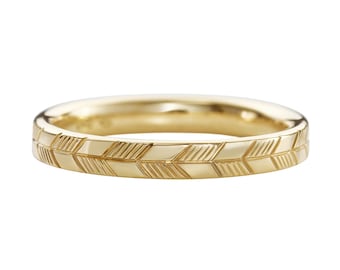 Golden Wedding Band with an Abstract Feather Engraving