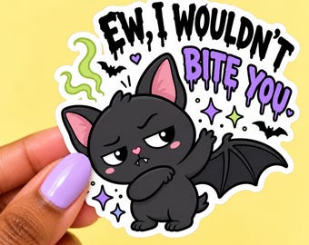 May include: A die-cut sticker featuring a black cartoon bat-cat hybrid with pink ears and a small fang, dabbing. The text reads "EW, I WOULDN'T BITE YOU" in black and purple dripping letters, surrounded by green stink lines, small bats, and colorful stars.