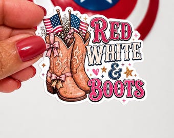 May include: A sticker featuring a pair of brown cowboy boots with American flags and the text "Red, White & Boots" in red and white. The sticker has a white border and is decorated with stars and hearts.