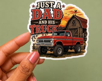 May include: A die-cut sticker featuring a red pickup truck parked in front of a rustic wooden barn at sunset. The text reads JUST A DAD AND HIS TRUCK in bold, distressed lettering. The scene includes a weather vane on the barn roof and a golden sky.