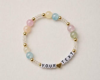 Customized UV beaded bracelet. 14k gold plated spacer beads.