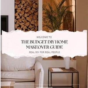 May include: A home decor image featuring a neutral-toned living room setting. A white sofa, a small wooden side table, and a decorative stack of firewood are visible. The text on the image reads "WELCOME TO THE BUDGET DIY HOME MAKEOVER GUIDE".