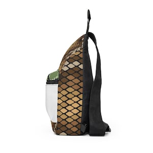 May include: A backpack featuring a brown and tan snakeskin design. It has black straps and a white mesh side pocket. The top handle is black.