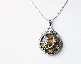 SALE!  Sterling silver pendant with tiger's eye cabochon set in Chinese dragon form