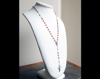 Sterling silver rosary necklace with plain and red crystal beads on a clasp-free chain