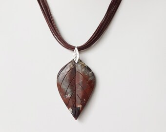 Multi colour picasso jasper leaf pendant with sterling silver bail and brown cord neckpiece with sterling silver end caps and clasp