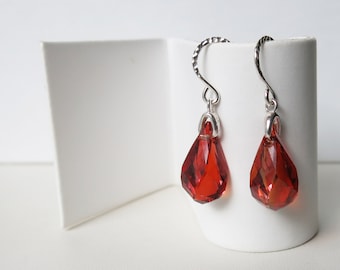 Sterling silver and warm red faceted Swarovski crystals dangling from hammered hooks
