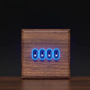 May include: A square wooden light switch plate featuring a dark brown wood grain finish. The plate contains four vertical toggle switches, each surrounded by a glowing blue rectangular light border, set against a dark background.