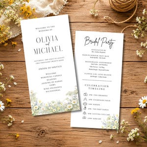 Könnte beinhalten: Zwei weiße Hochzeitskarten mit schwarzem Text und einem Aquarell-Wildblumenrand. Die linke Karte zeigt die Namen Olivia und Michael, während die rechte Karte die Hochzeitsgesellschaft und einen Zeitplan mit Symbolen für die Ereignisse auflistet.