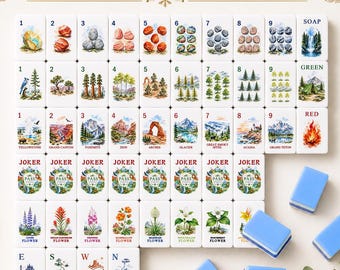 May include: A National Parks Mahjong set featuring white tiles with colorful illustrations of landscapes, flora, and geological formations. The set includes numbered tiles, Joker tiles, and directional tiles, with several solid light blue tiles.